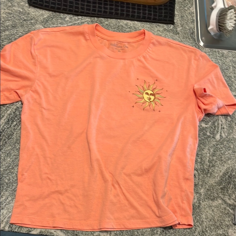 Rebellious One Coral Tee with Sun and Floral Design
